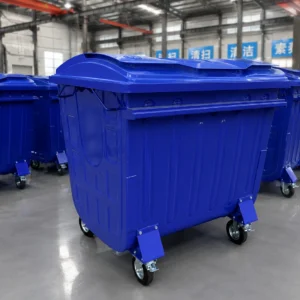 Blue Metal Four-Wheel Waste Containers Factory Bulk Production Blue metal four-wheel waste containers arranged in a factory for bulk production