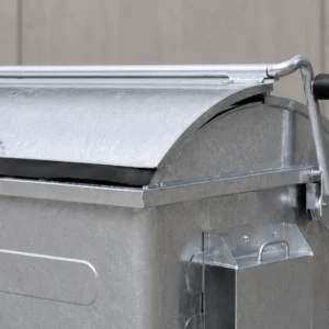 Galvanized Metal Waste Container Curved Lid Hydraulic Handle Detail Close-up of galvanized metal waste container with curved lid and hydraulic handle mechanism