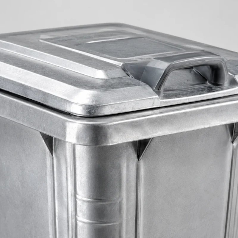 Galvanized Steel Wheelie Bin Lid and Handle Detail Close-up of galvanized steel wheelie bin lid and handle detail
