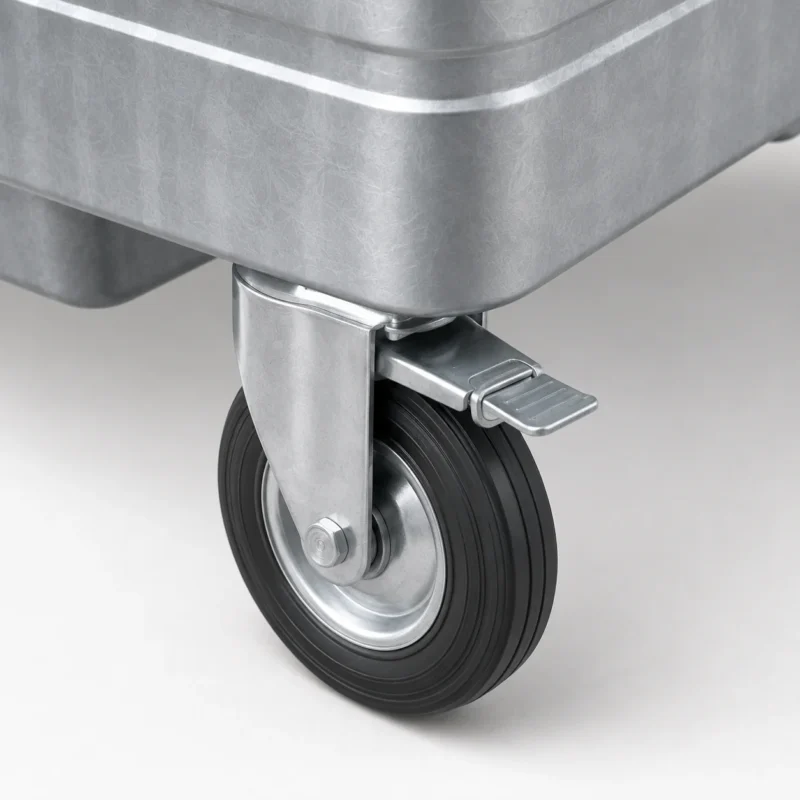 Close-up of braked caster wheel on a metal four-wheel waste container