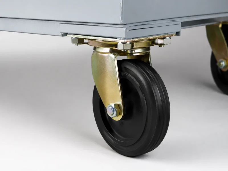 Close-up of heavy-duty caster wheel on a metal four-wheel waste container