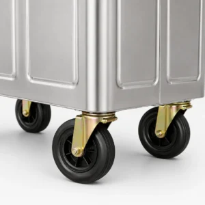 Close-up of caster wheels on a metal four-wheel waste container