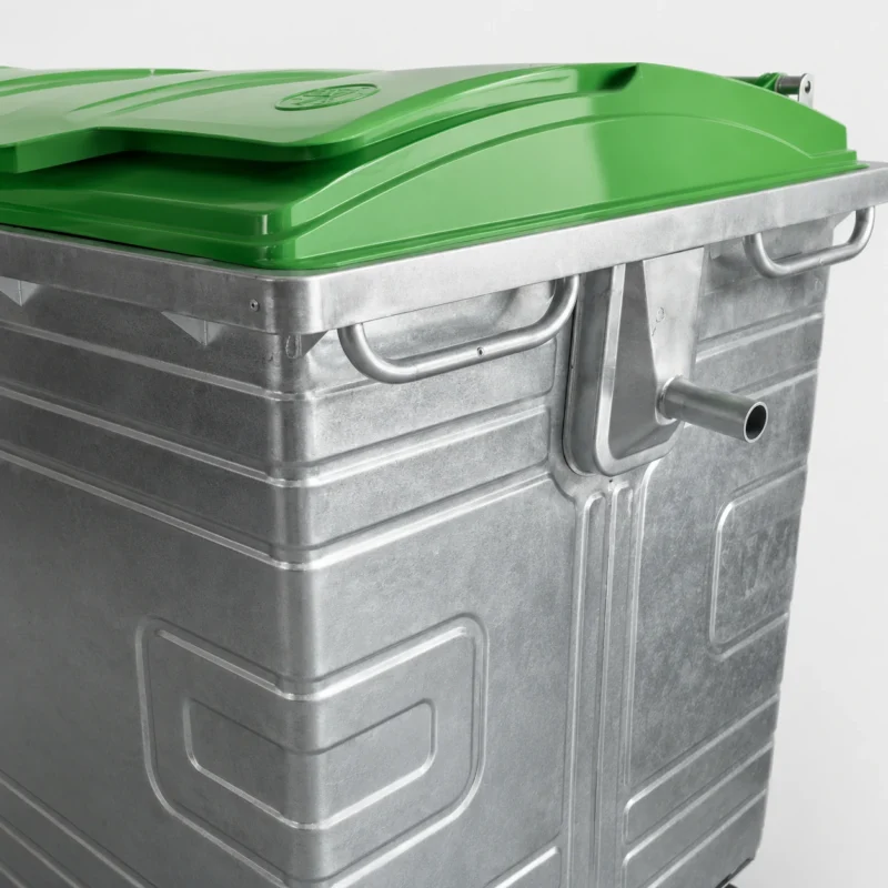 1100L Galvanized Steel Waste Container Lifting Interface Detail | KOVANTO Close-up of green plastic lid and side lifting interface on a 1100L galvanized steel waste container