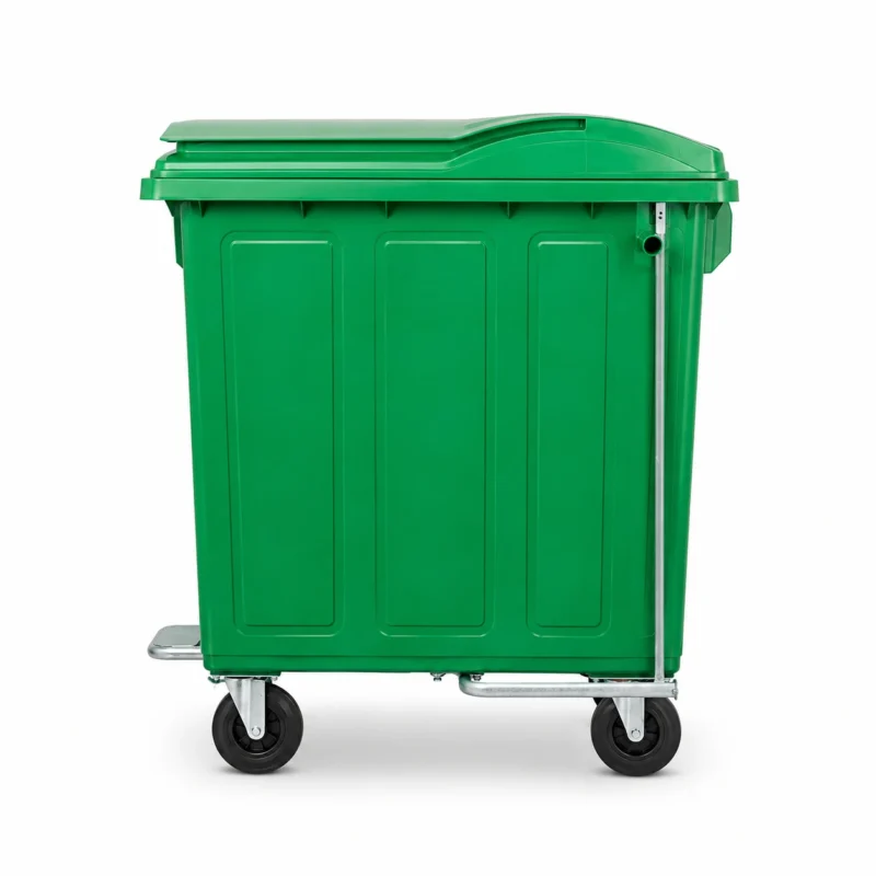 Side view of a 1100L green metal waste container with foot pedal opening system and four caster wheels