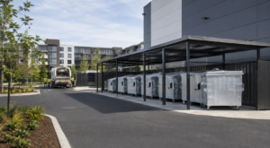 Galvanized waste containers at a modern commercial collection point