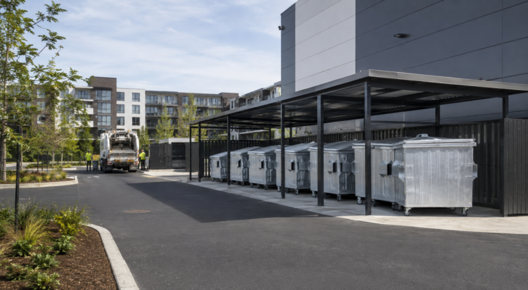 Galvanized waste containers at a modern commercial collection point